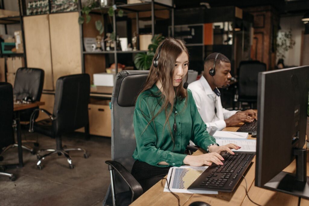 Agents with headsets working at computers