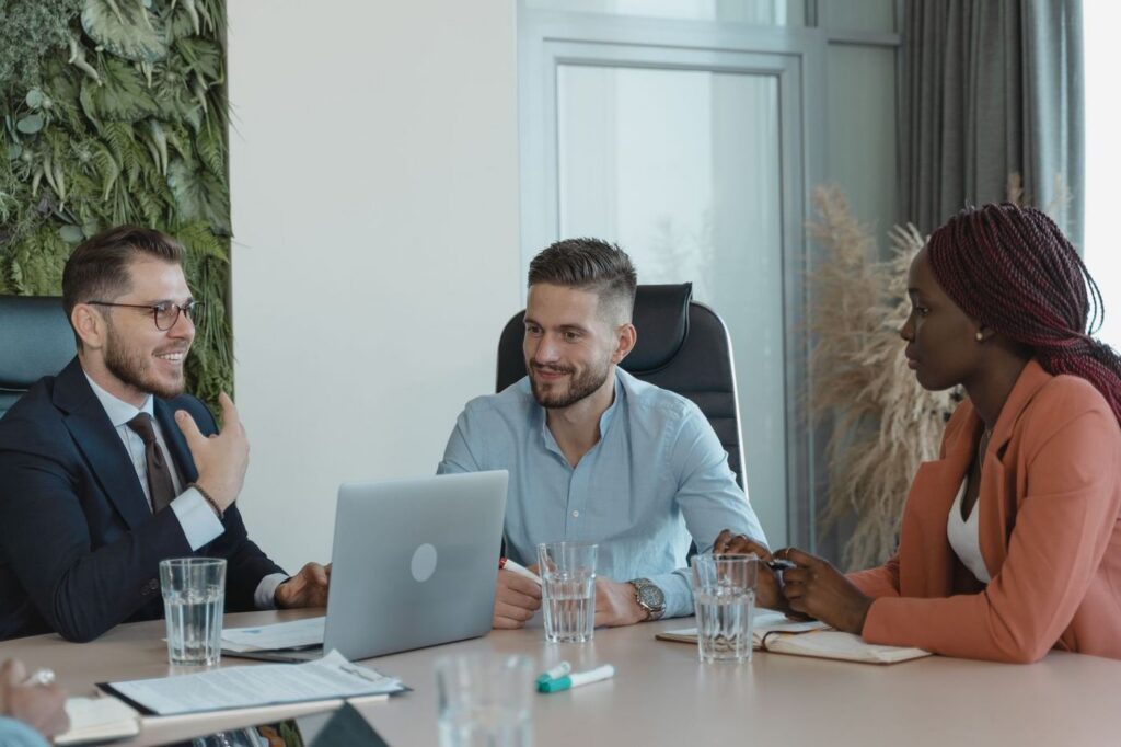 Business leaders meeting with a technology advisor