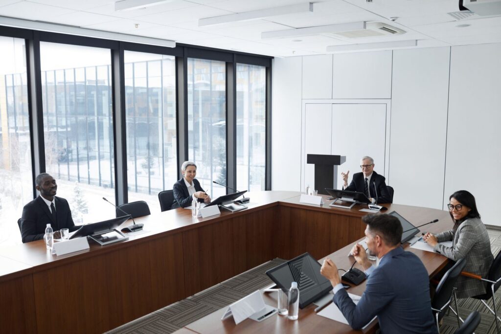 Officials meeting in a government conference room