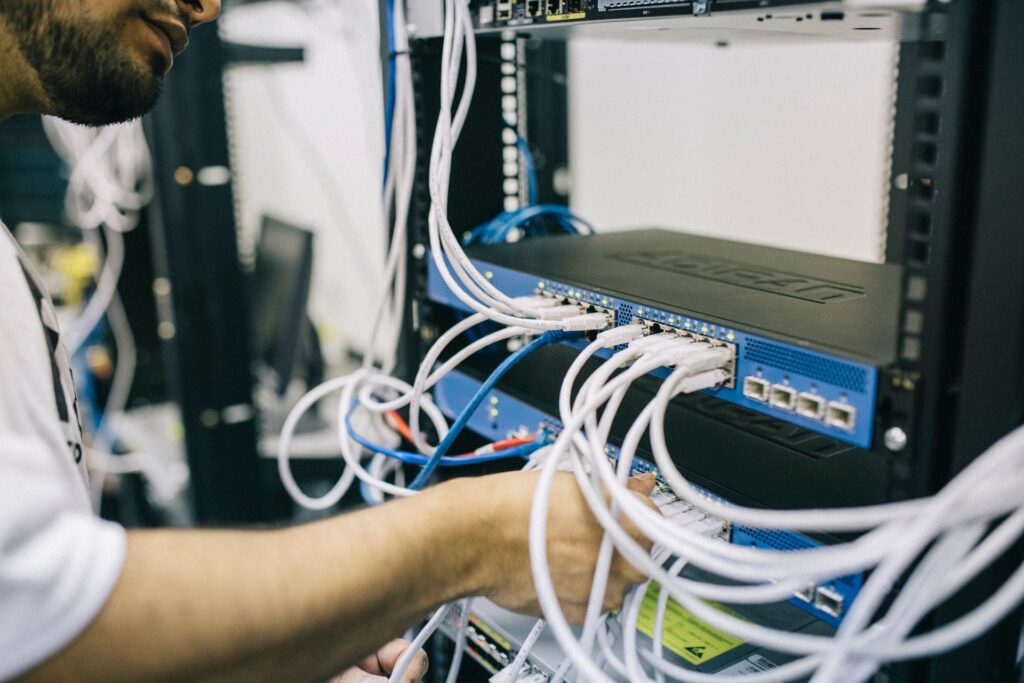 Technician installing network cabling